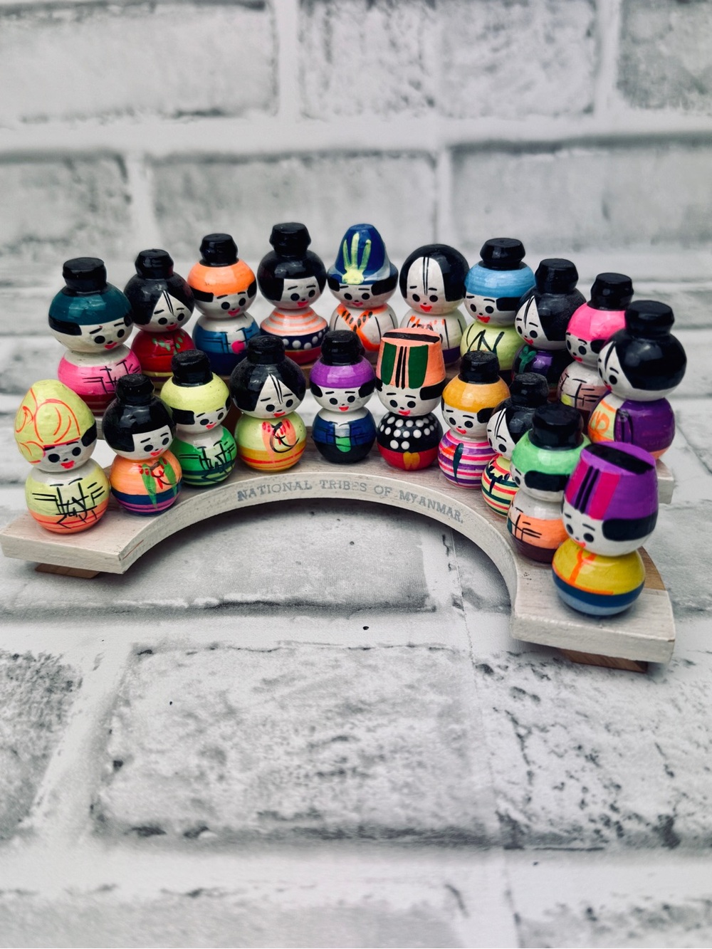 Vintage National Tribes of Myanmar wood doll miniatures on stand.